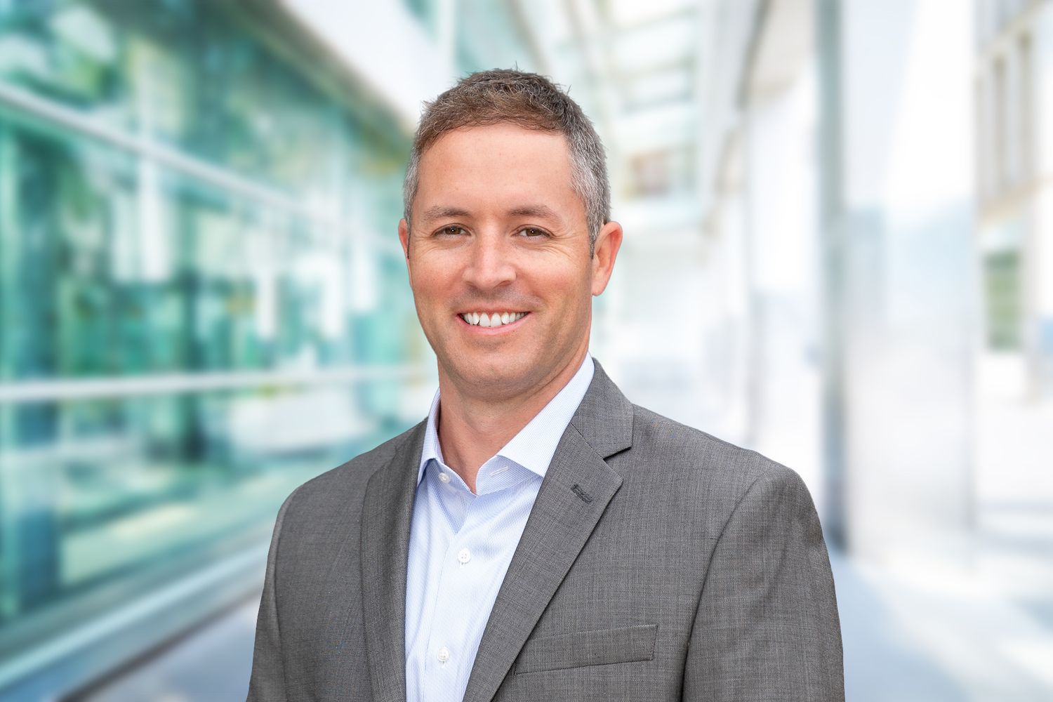 professional corporate headshot taken outside an office building by NJ's premier headshot specialists Just A Soul Photo