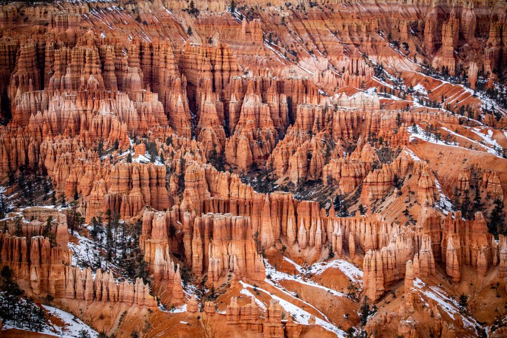 Snow-dusted red rock hoodoos and spires of Bryce Canyon National Park.