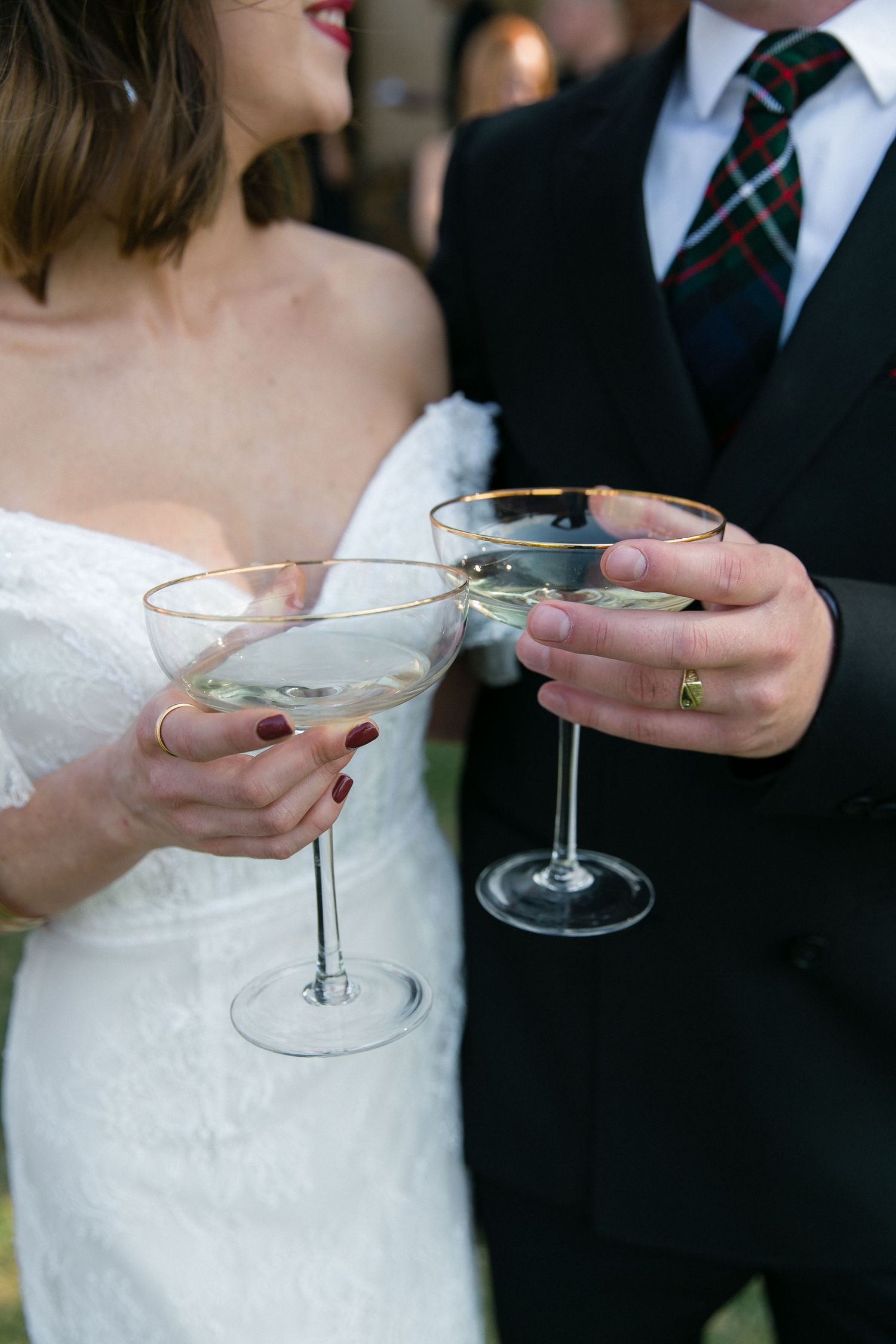 Champagne toasts at The Hothouse Venue in Dullstroom. Showing the details on a groom's brand new wedding ring.