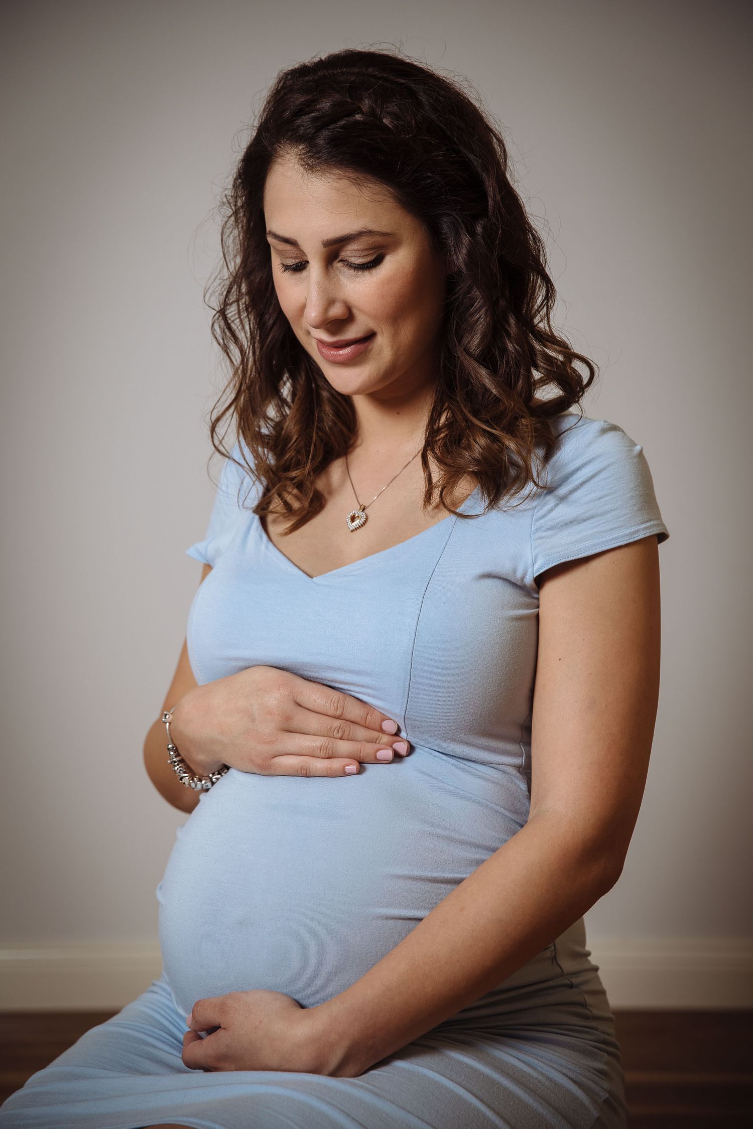 Mum holding pregnant belly