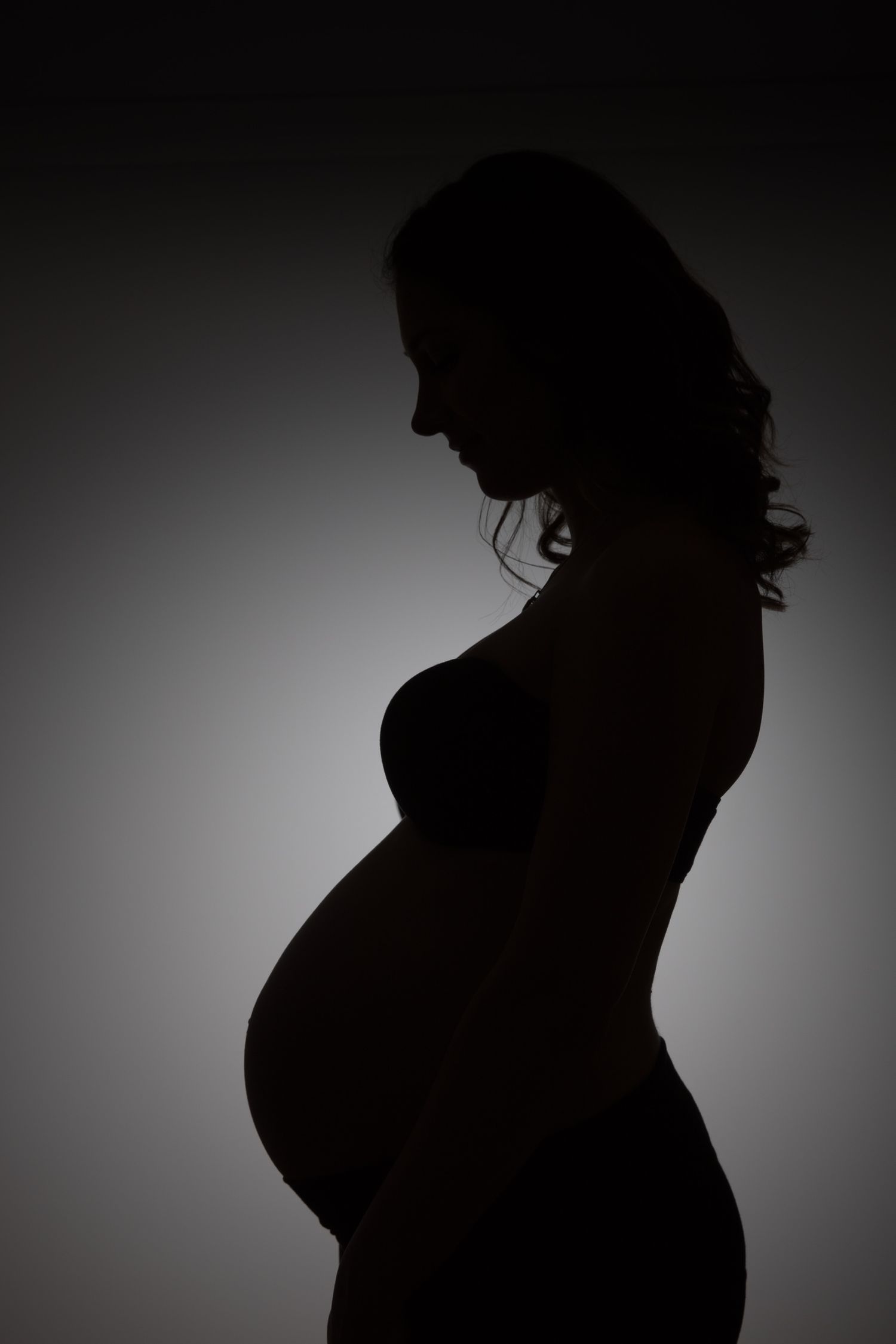 Silhouette of pregnant mother