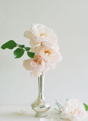 small silver vase with pale pink teacup roses