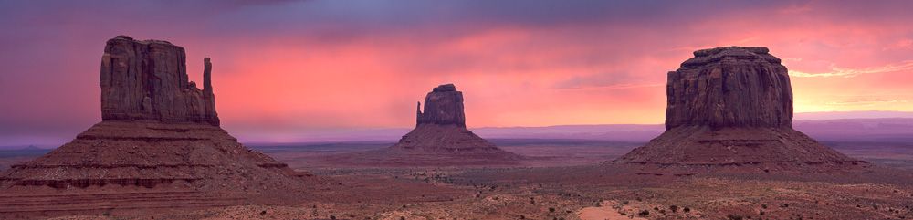 Panorama of the Mittens in Monument Valley, Arizona at sunset
