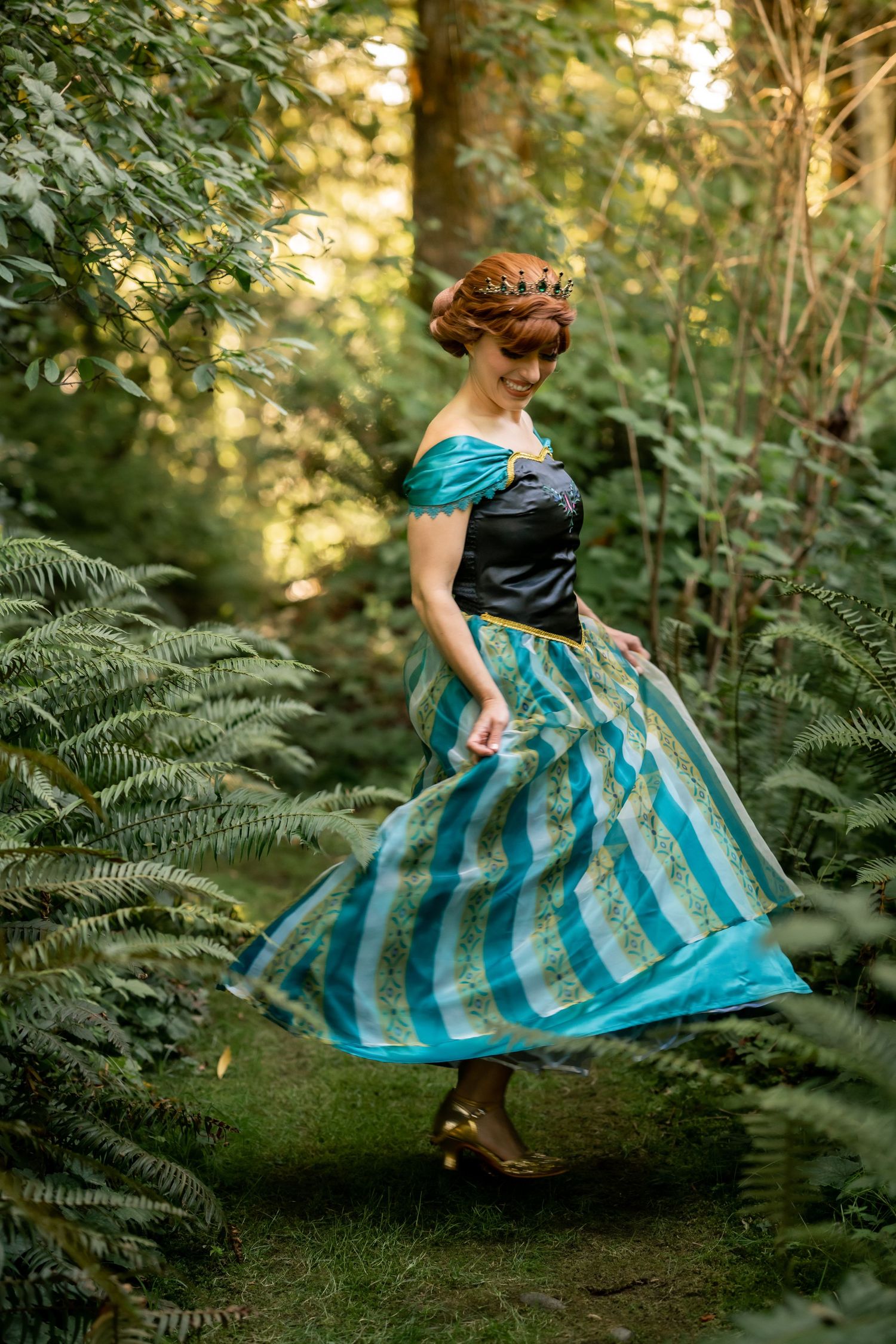 Whimsical forest scene with vintage teal striped dress among ferns.