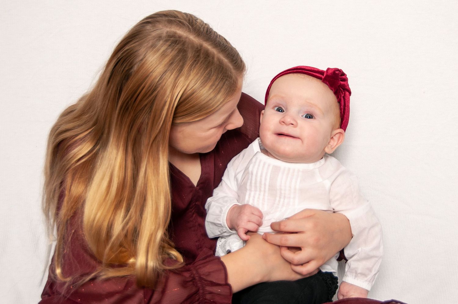 Two girls on white backdrop candid