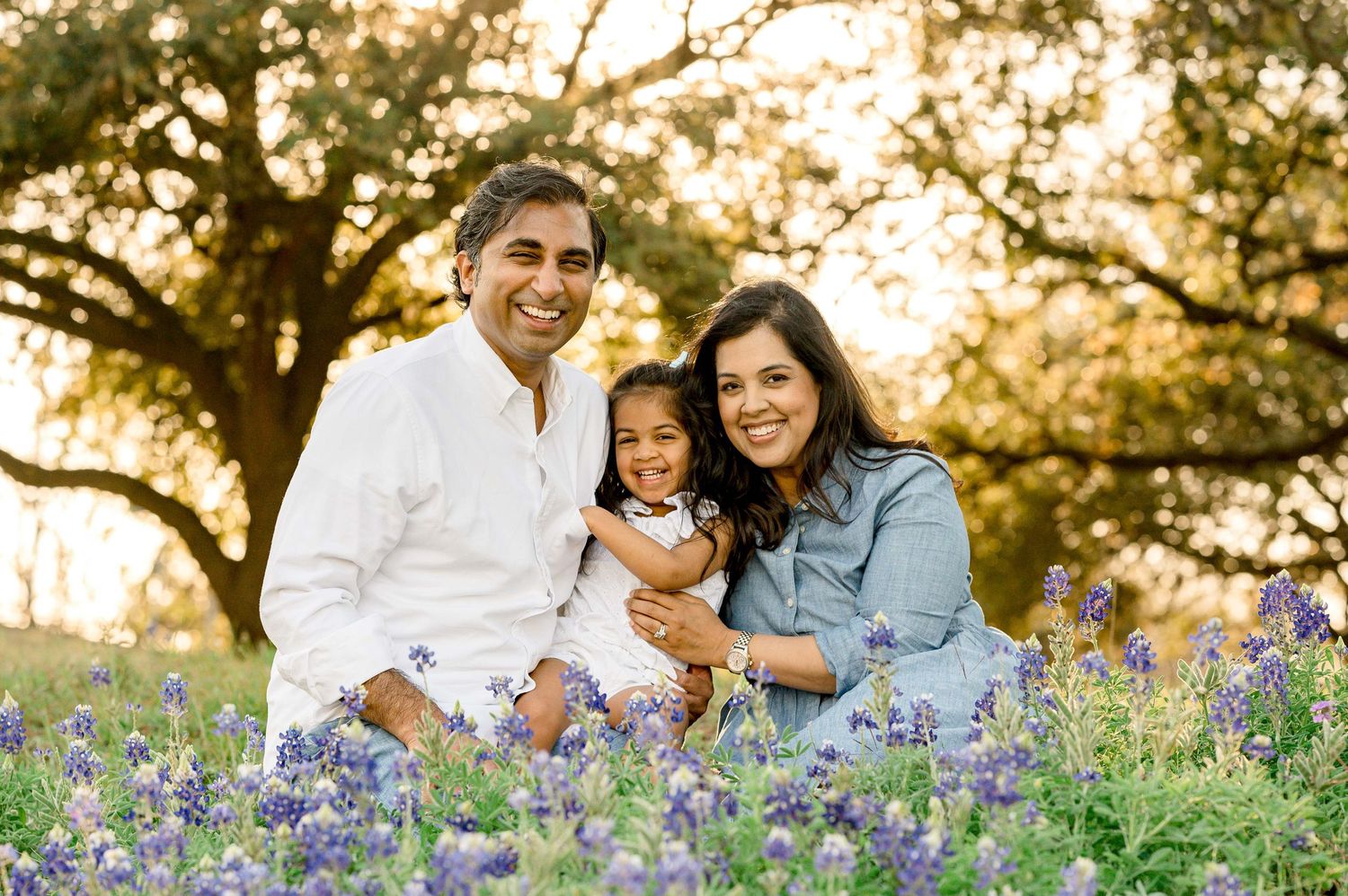 bluebonnet mini session in houston texas during the golden hour with a family of three