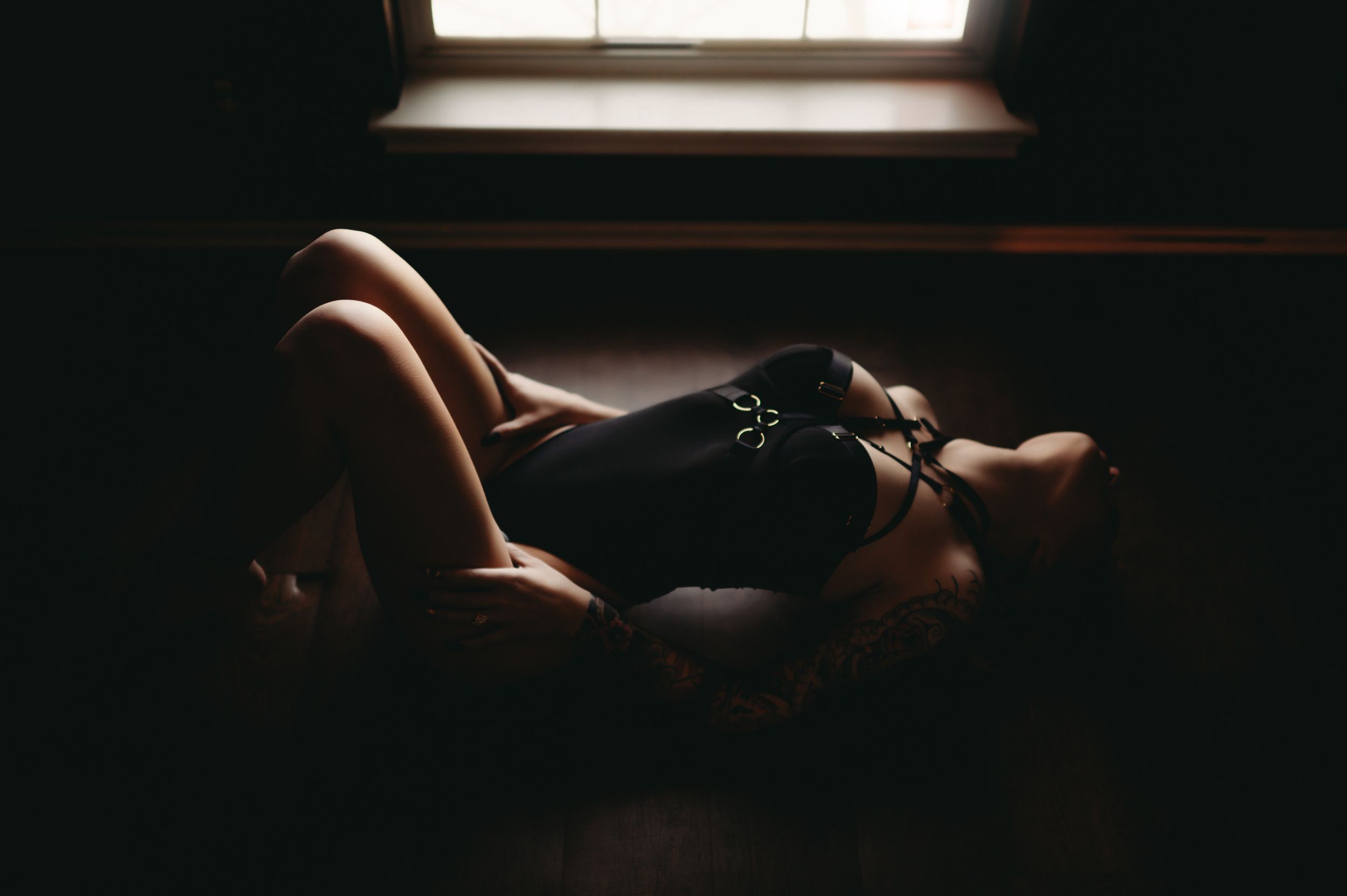 Empowering boudoir image capturing a woman's journey to self-confidence.