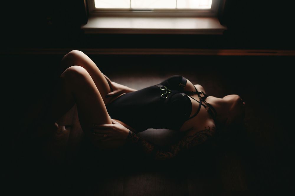 Empowering boudoir image capturing a woman's journey to self-confidence.
