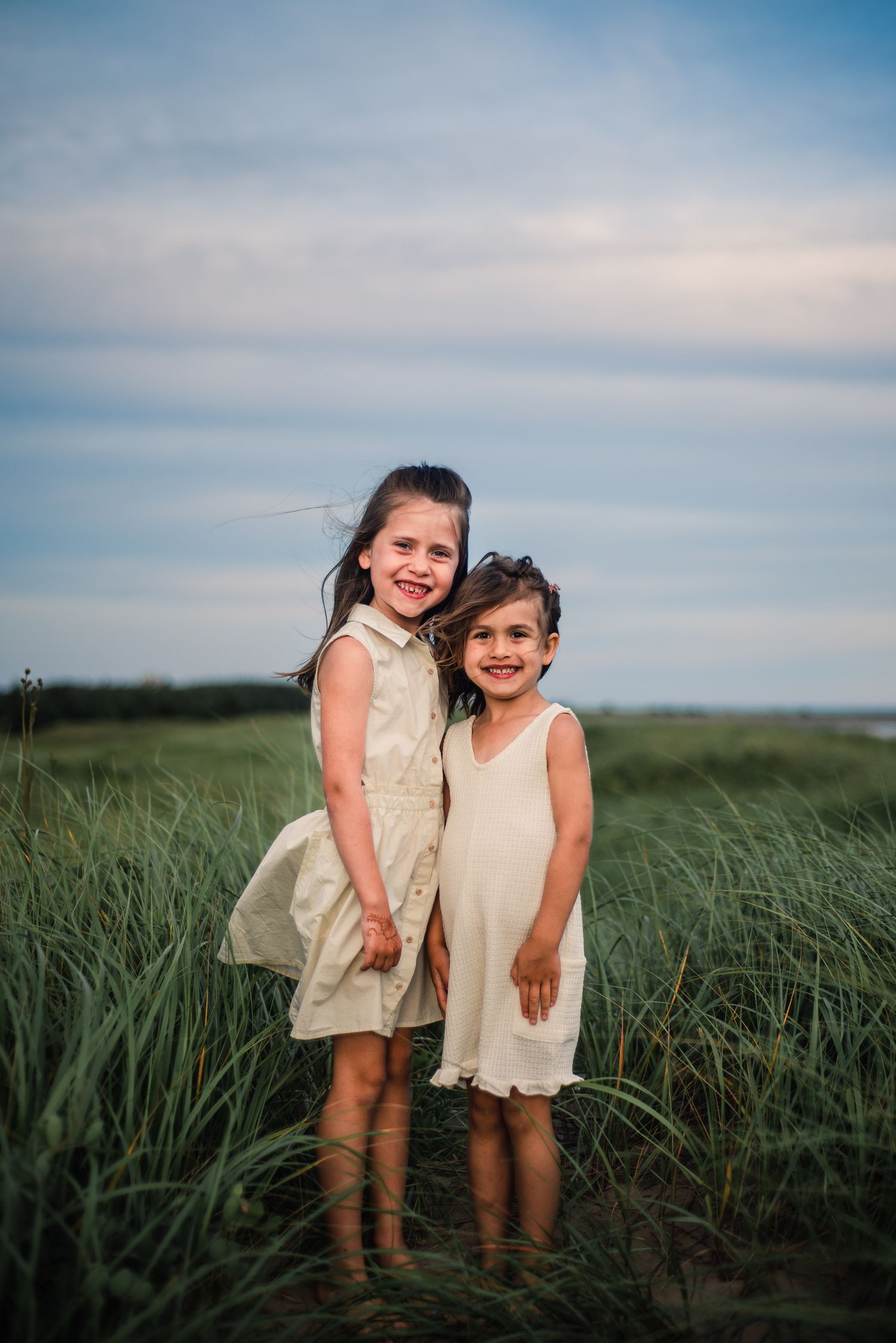 Family photograph of two young sisters at Conrad Beach, Nova Scotia