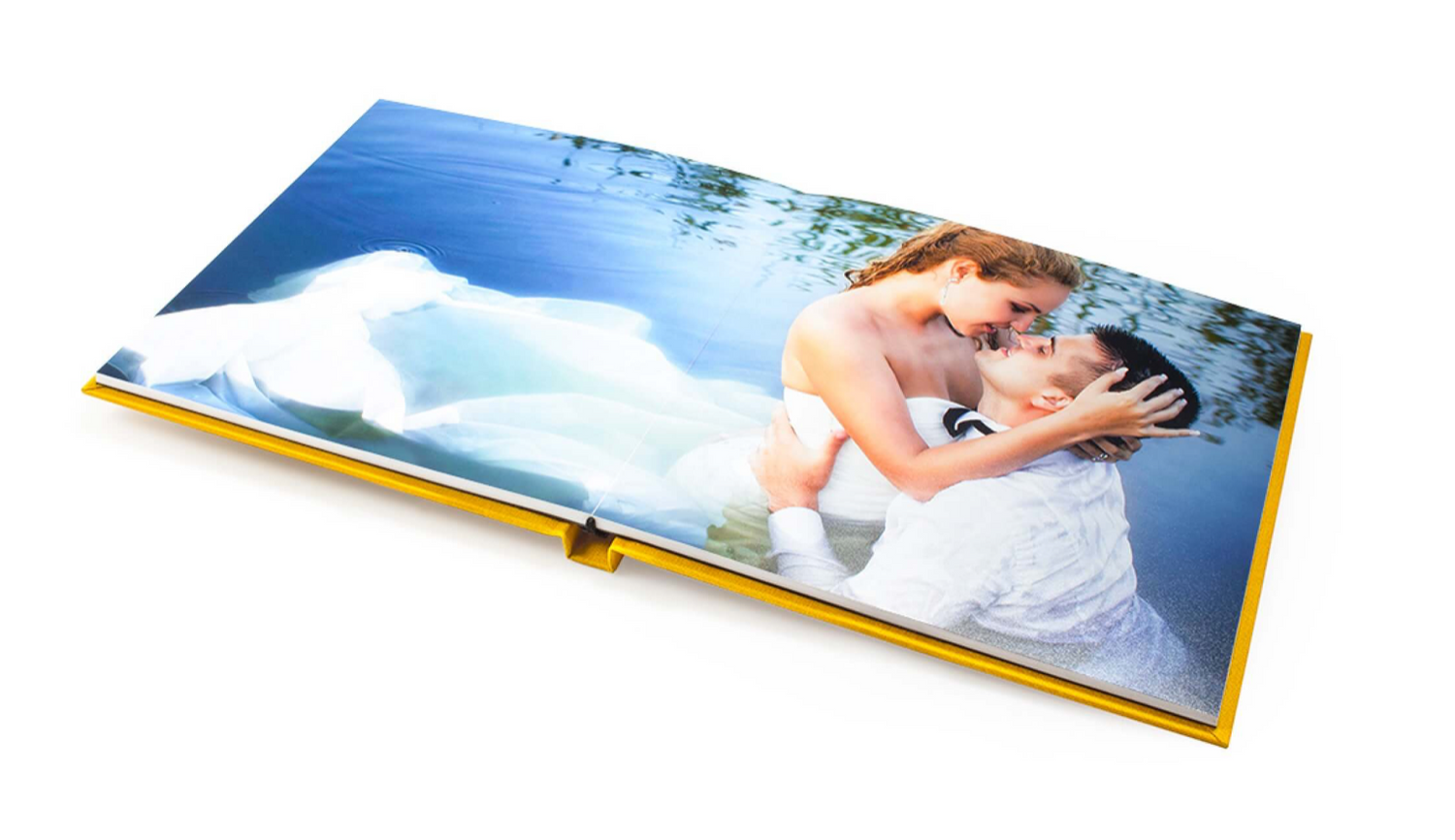 Wedding photo album opened to display a romantic lakeside photo spread.