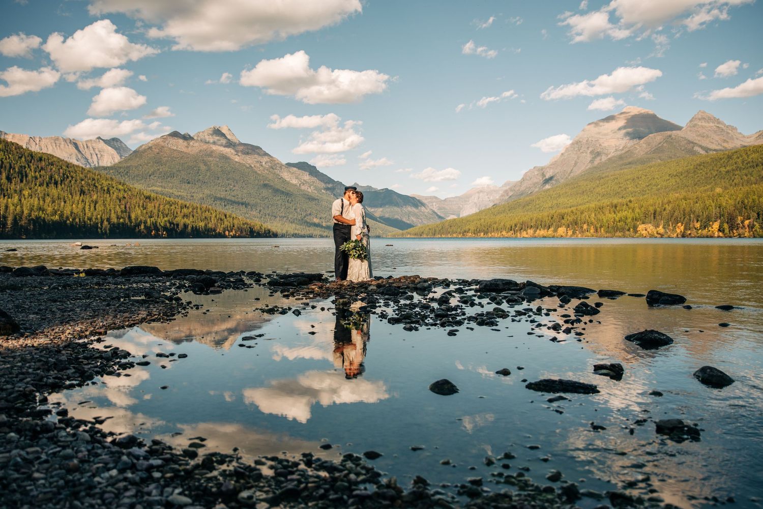couple getting married at bowman Lake in glacier national park