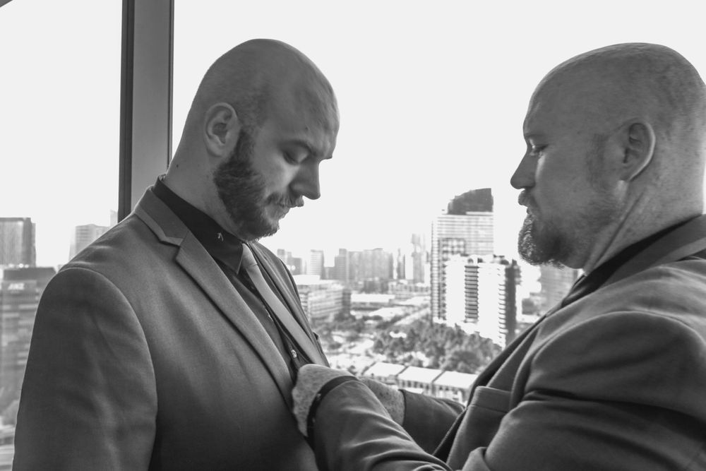 two grooms preparing for wedding ceremony melbourne same sex photographer