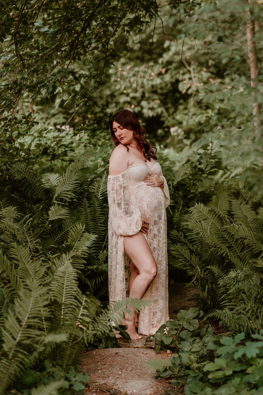 A dreamy portrait session among lush ferns and forest greenery.