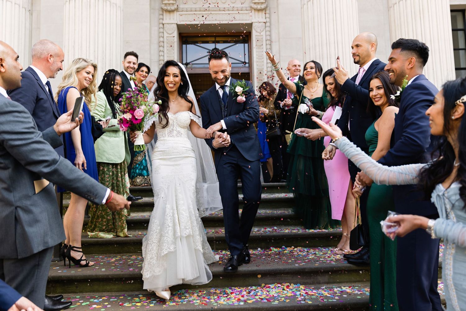 Bride, Groom and confetti at the Old Marylebone Town Hall, captured by London Wedding Photographer Mykola Tsap