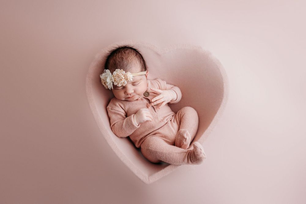 pink heart bowl outfit newborn posed photographer studio trained skilled professional session local east aurora NY WNY