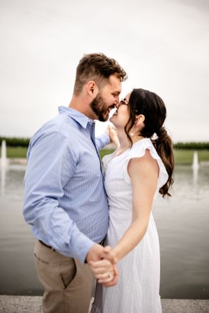 Intimate lakeside engagement photos capturing romantic moments between couple.