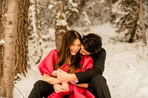 Intimate winter photo sequence among snow-covered trees with red dress accent.