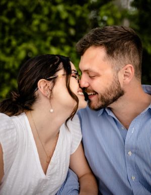 A romantic couple sharing intimate moments in a series of close-up shots outdoors.