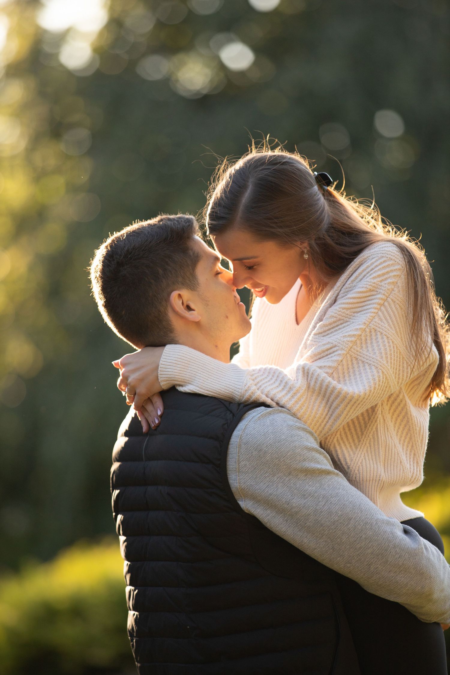 Photography; photographing the couple during their engagement photo session.