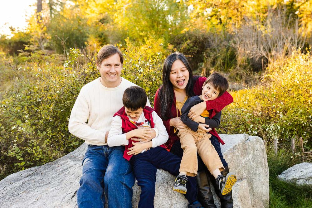 Joyful family tickling each other in Bellevue