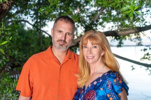 Outdoor portrait session among green trees and natural lighting.