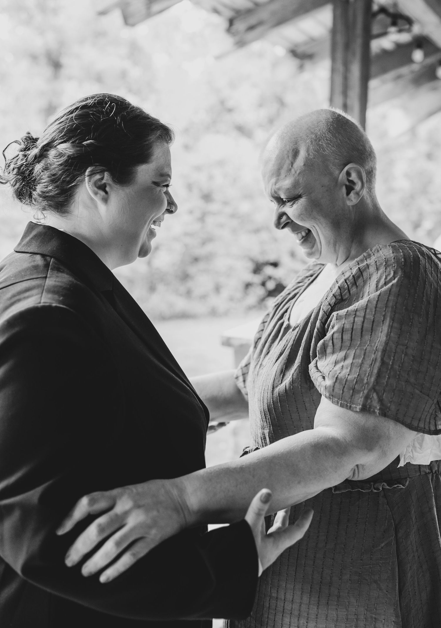 Two people share an intimate moment during what appears to be a wedding ceremony.