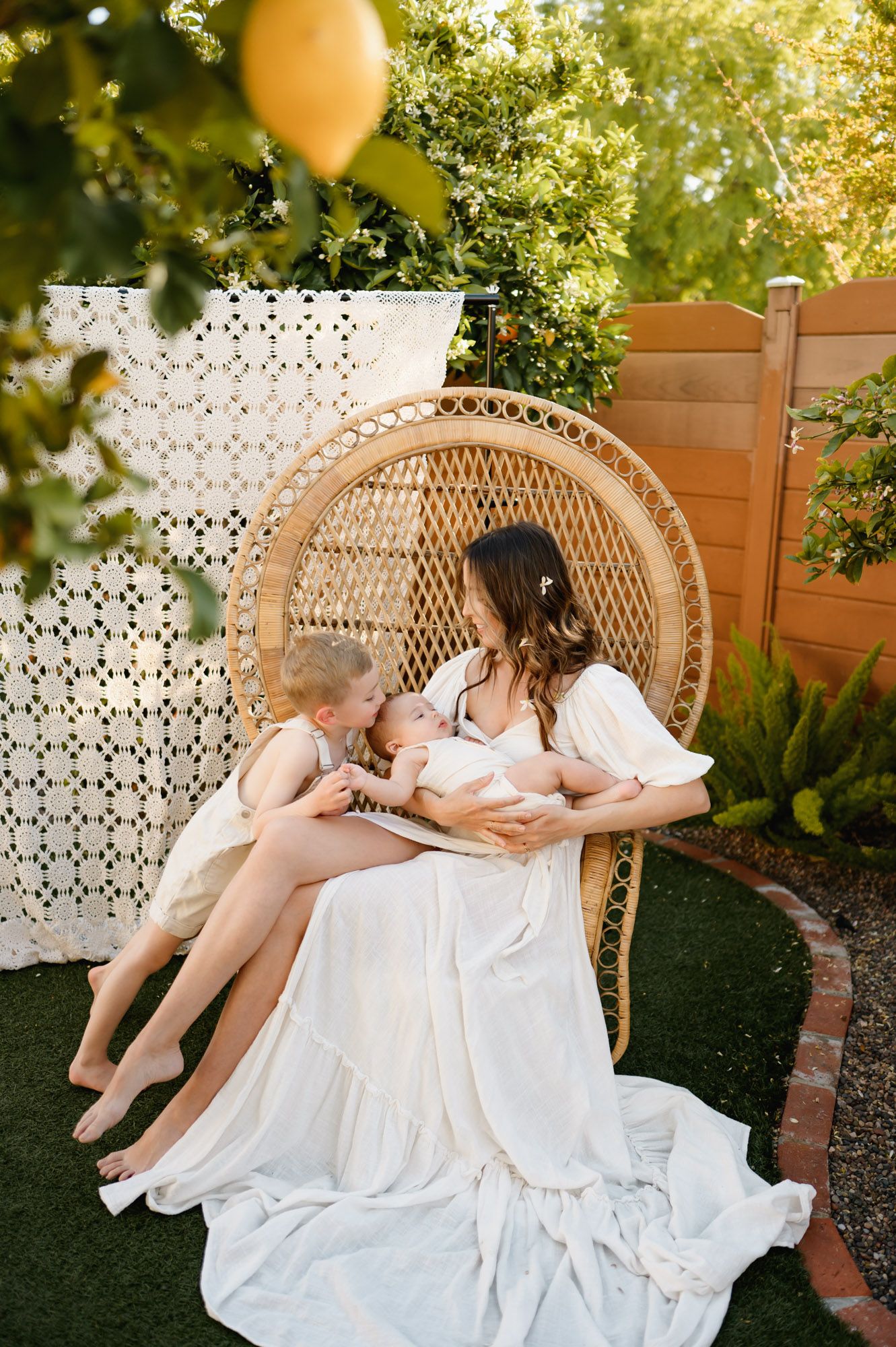 mom with her two young boys with blanket set up during mommy & me photoshoot by San Diego photographer, Tiffany Kelterer