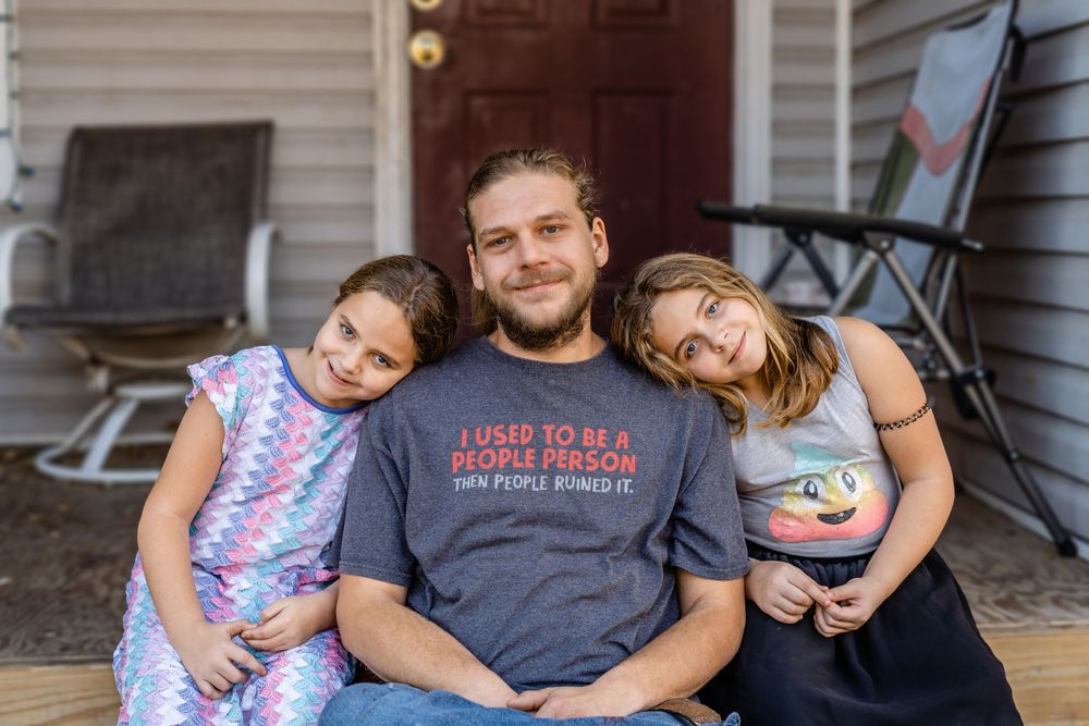 A father and his twin daughters