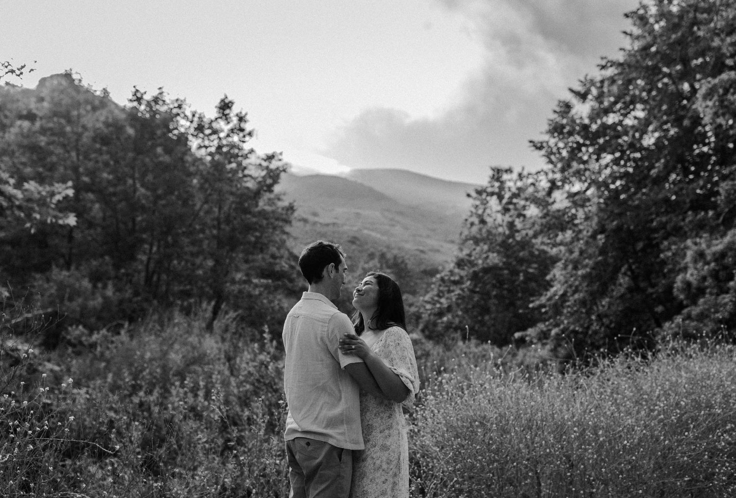 E. Noelle Photography couple engagement in the Los Angeles Malibu hills touching noses together with soft smiles