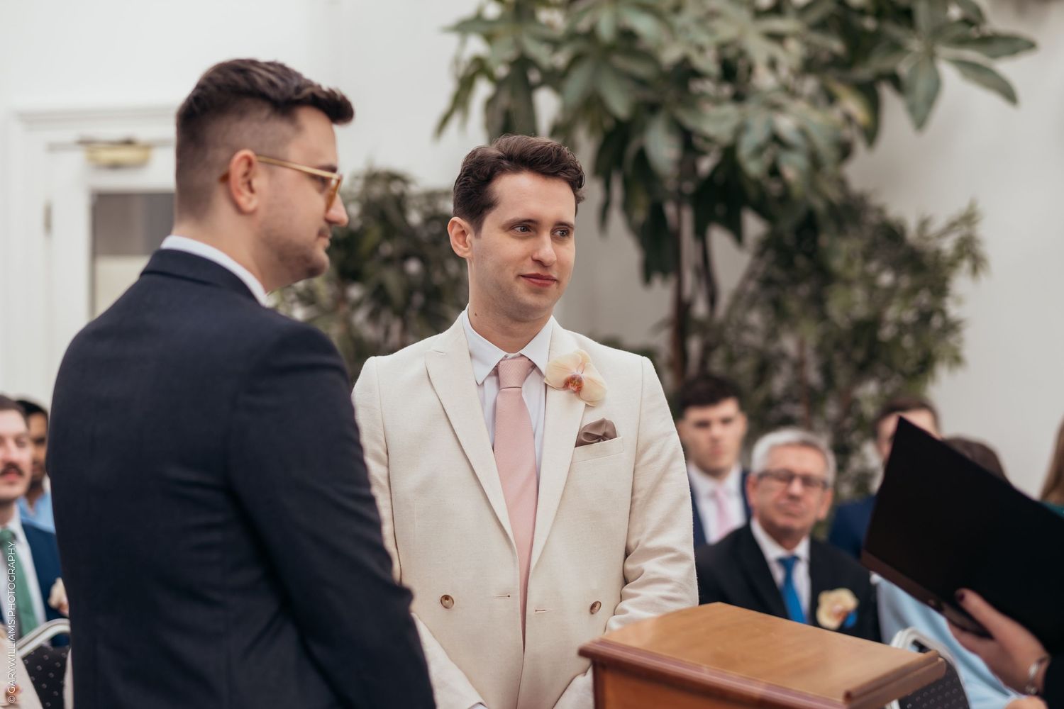 Newlywed grooms standing together at their gay wedding in Twickenham London