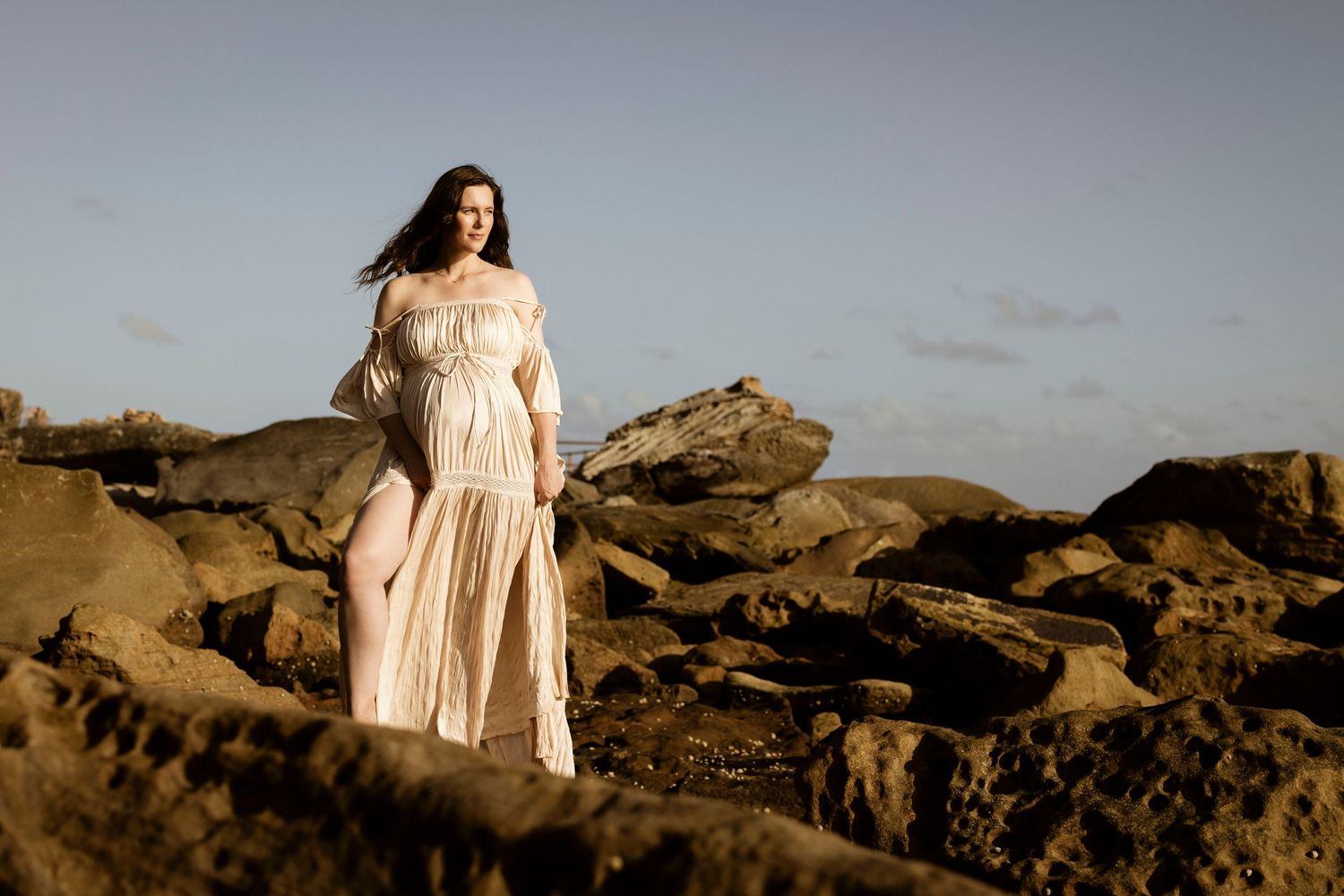 maternity moment on a tranquil beach in Sydney’s Northern Beaches