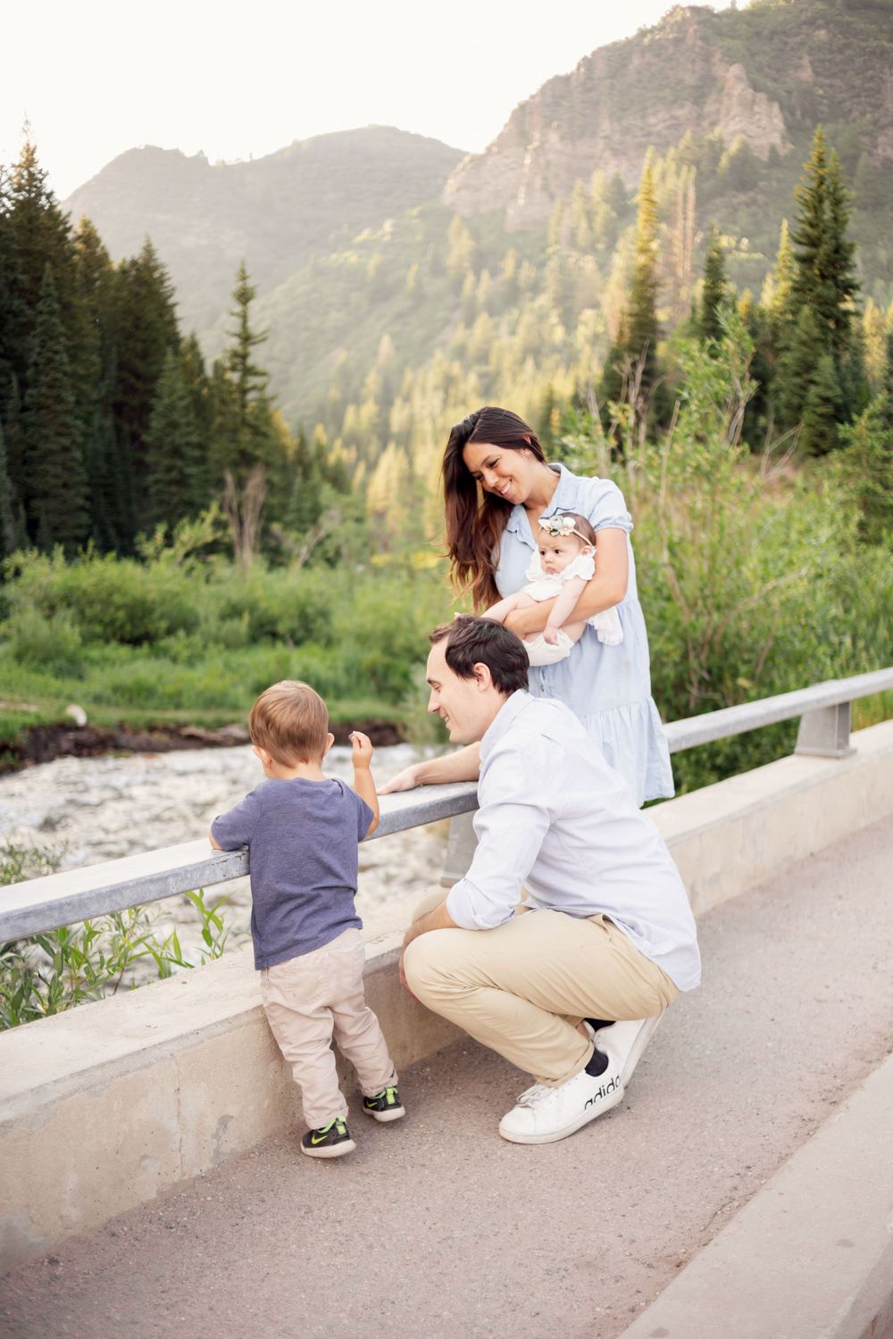 happy family candidly looking at a river in missouri
