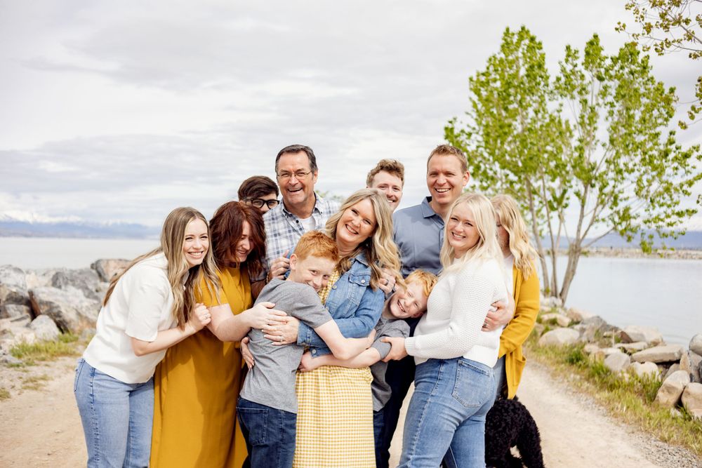 happy family hugging candidly