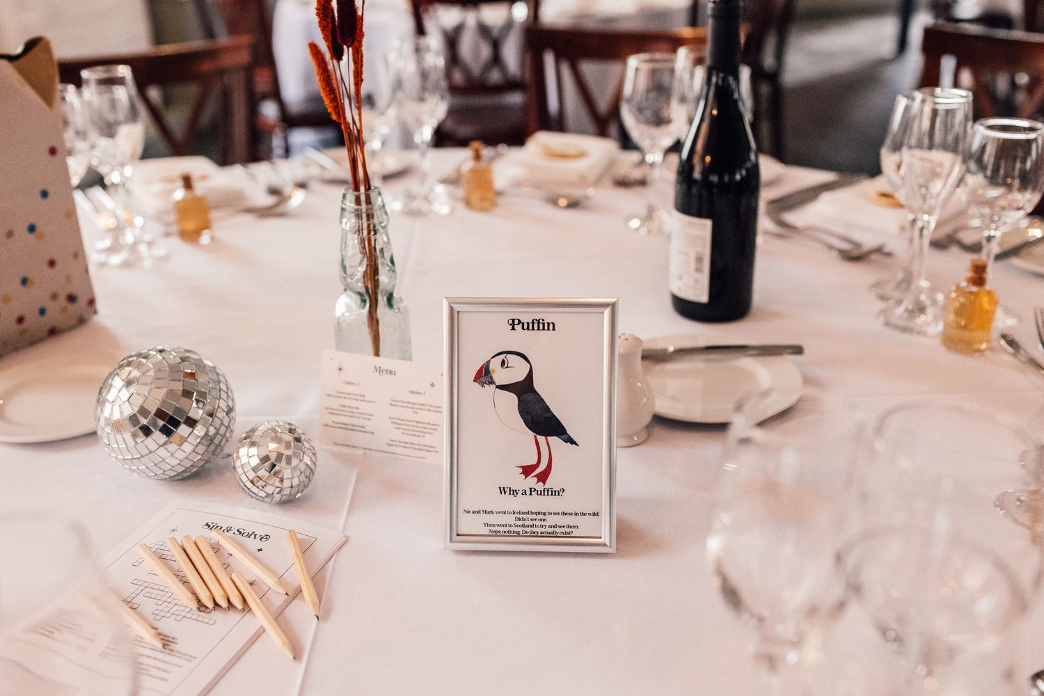 disco balls and photo frames on wedding table