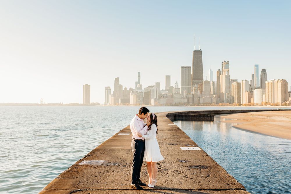 Engagement portrait of a man and woman at North Avenue Beach in Chicago, IL.