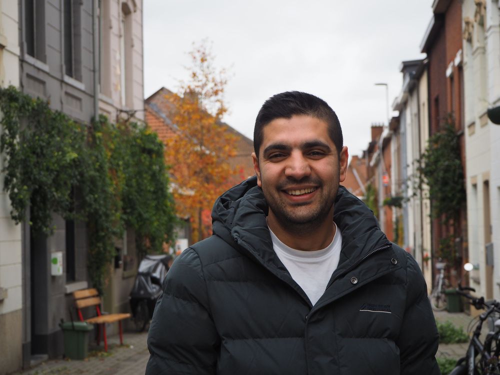 Portrait of a smiling guy in a street in Leuven