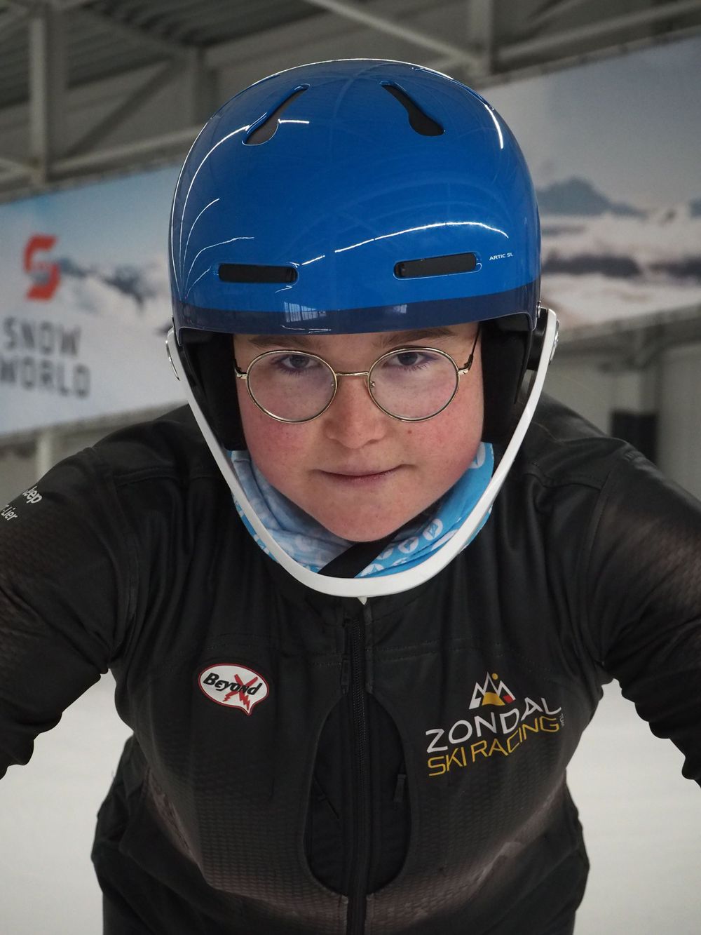 Portrait of a young women with ski helmet looking very focused