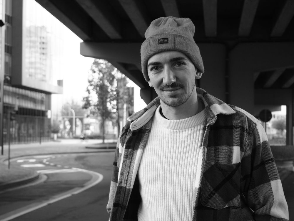Black and white portrait of a guy wearing a beanie