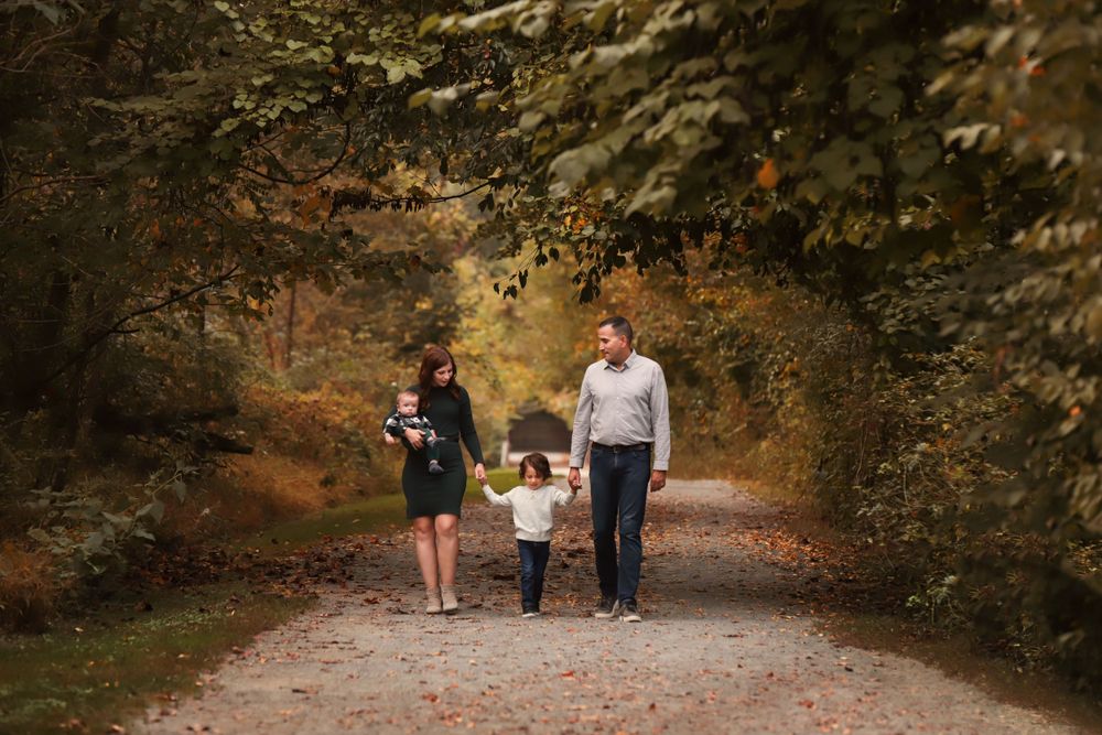 fine art fall family photo with fall leaves in harford county, maryland