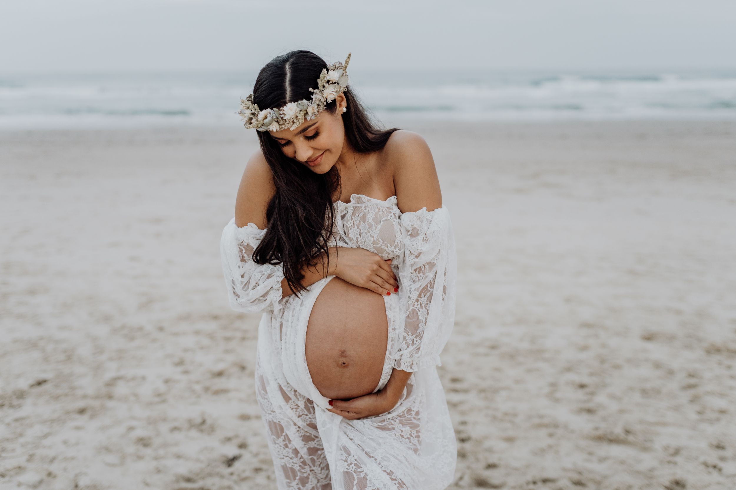An intimate maternity portrait session on the beach.