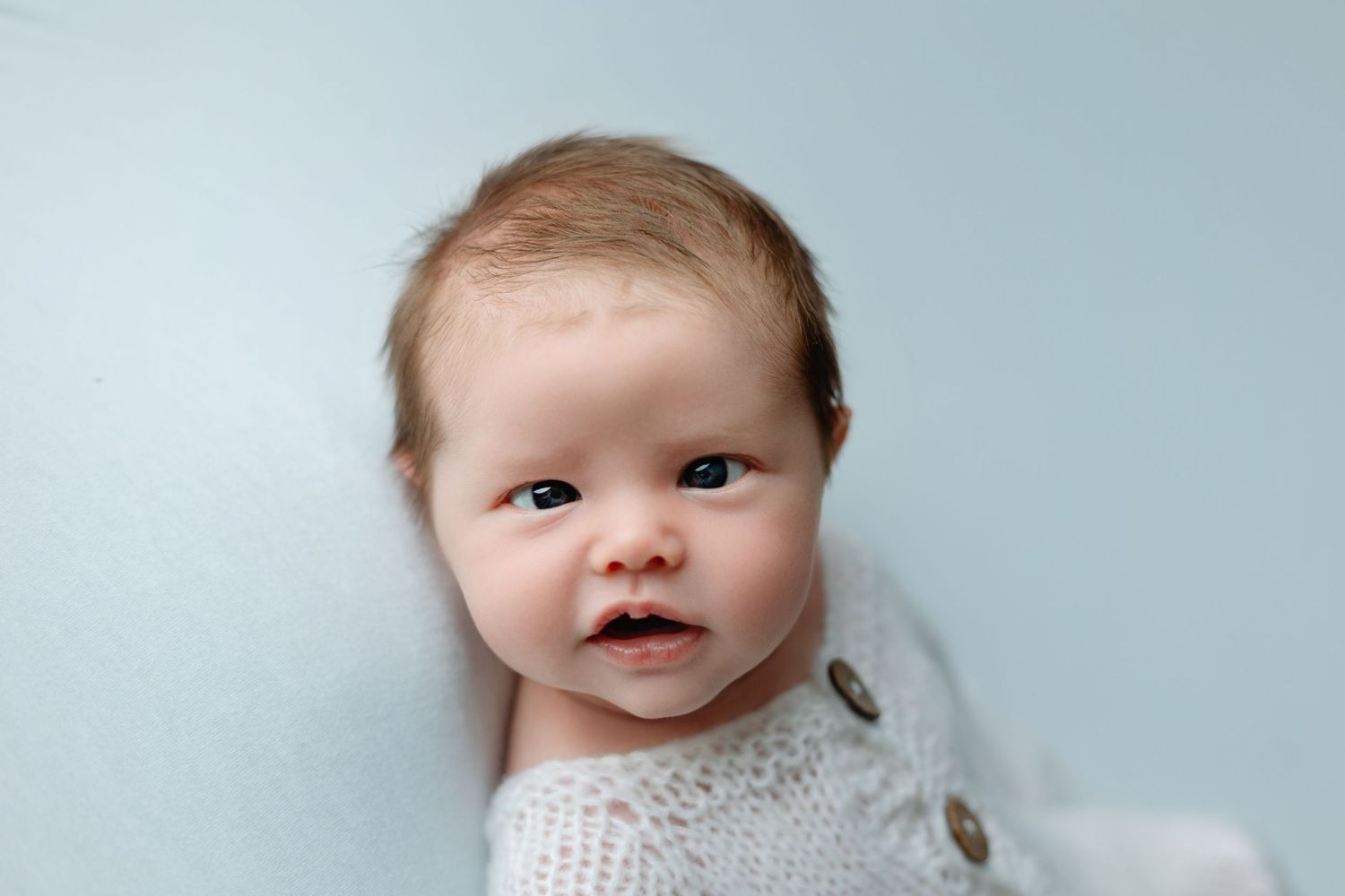 A newborn baby with his eyes crossed. Greenville SC newborn photographer, Easley, SC newborn photographer, Upstate SC newborn