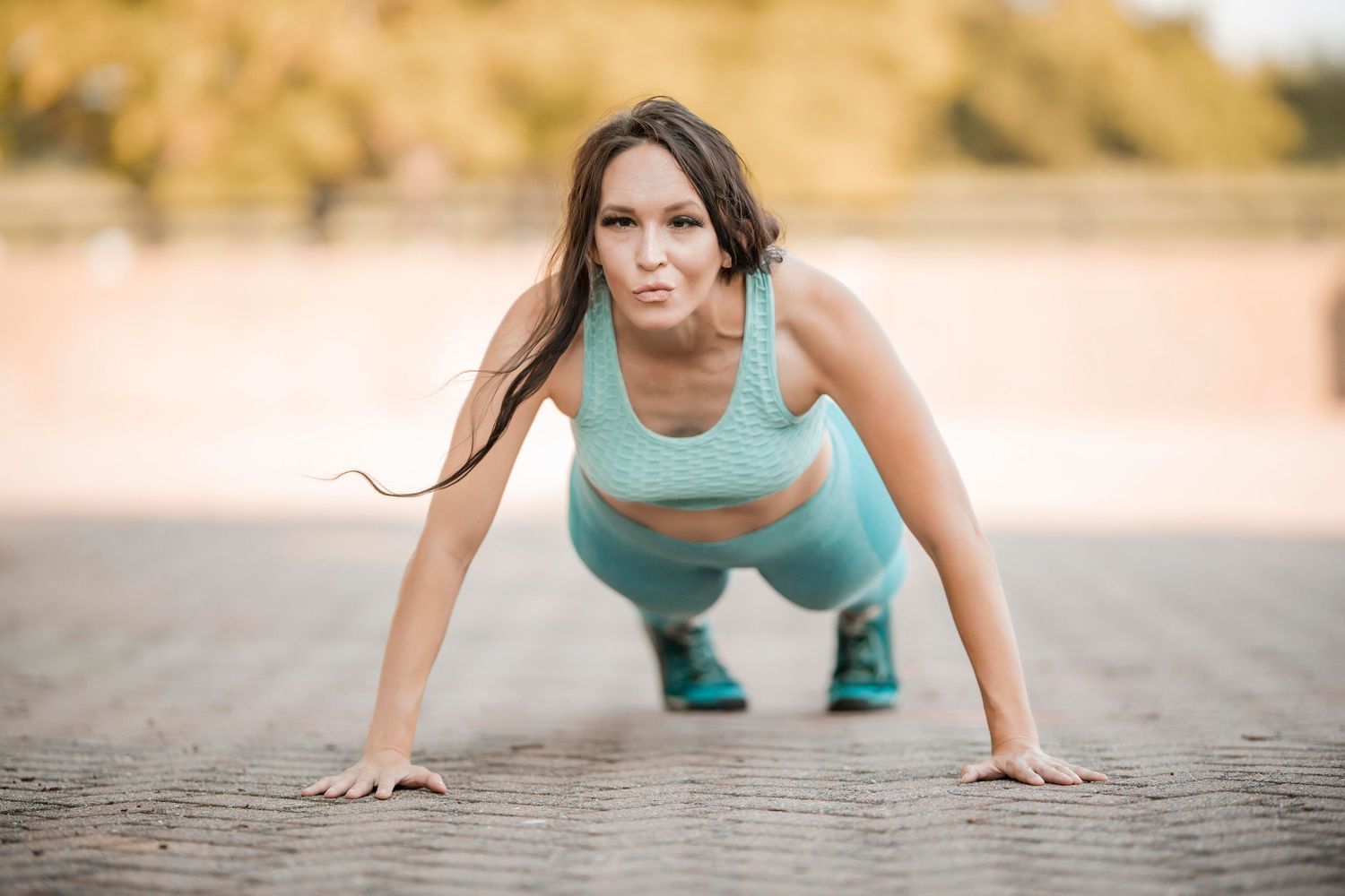 Fit girl working out doing pushups