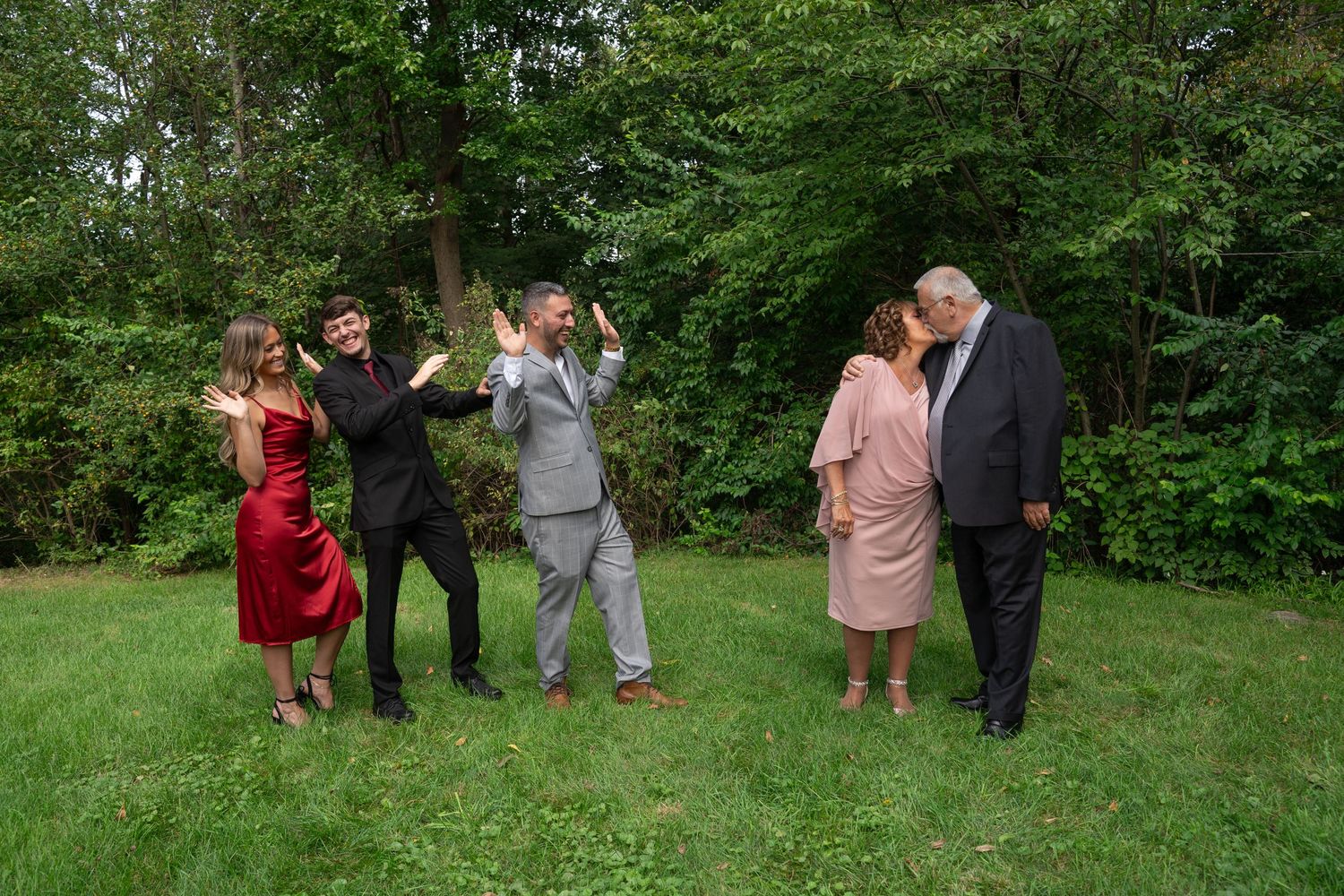 A wedding celebration in a backyard with people gathered around