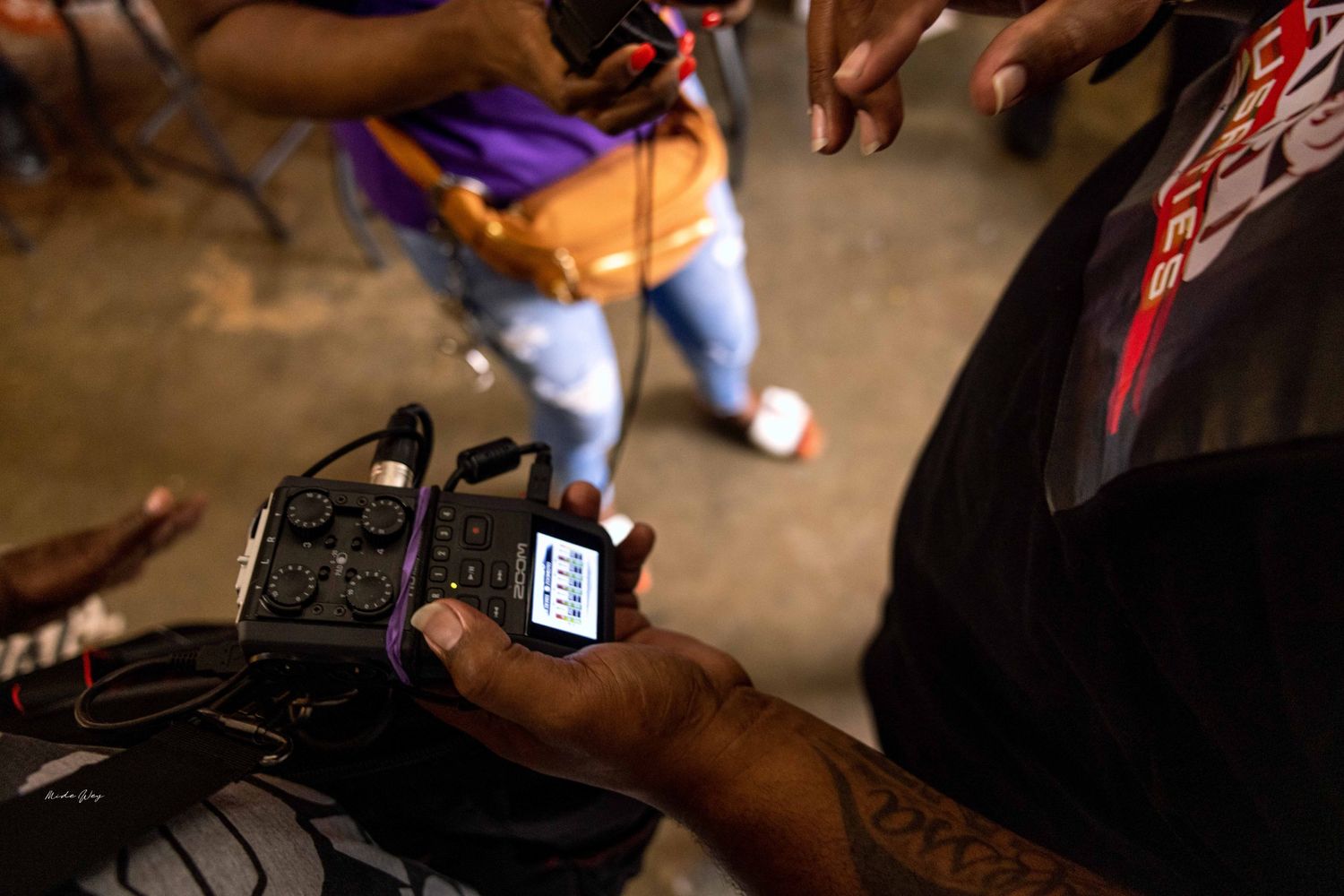 Close-up shot of hands holding and interacting with mobile devices.