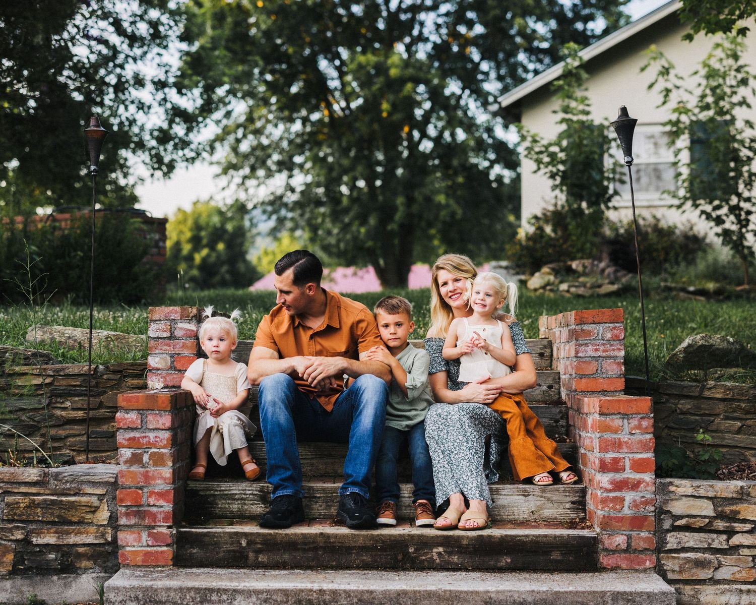 Family home photoshoot with a lovely family sitting on their porch
