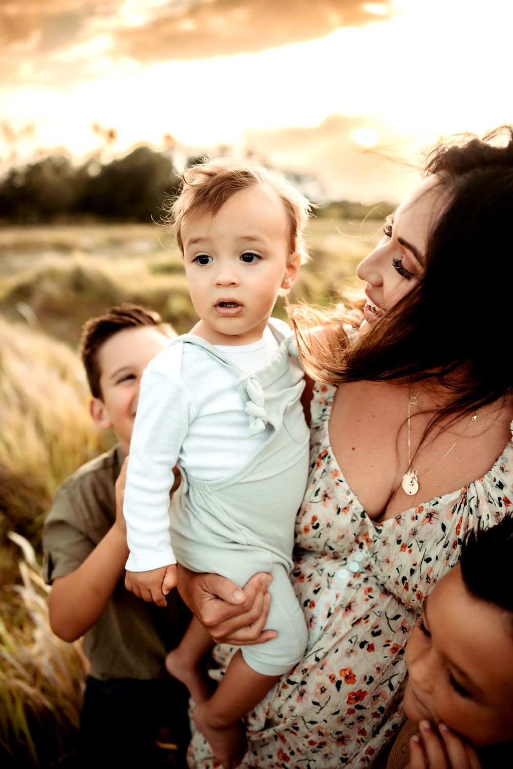 lakeland photographer- mother looking at baby boy at sunset