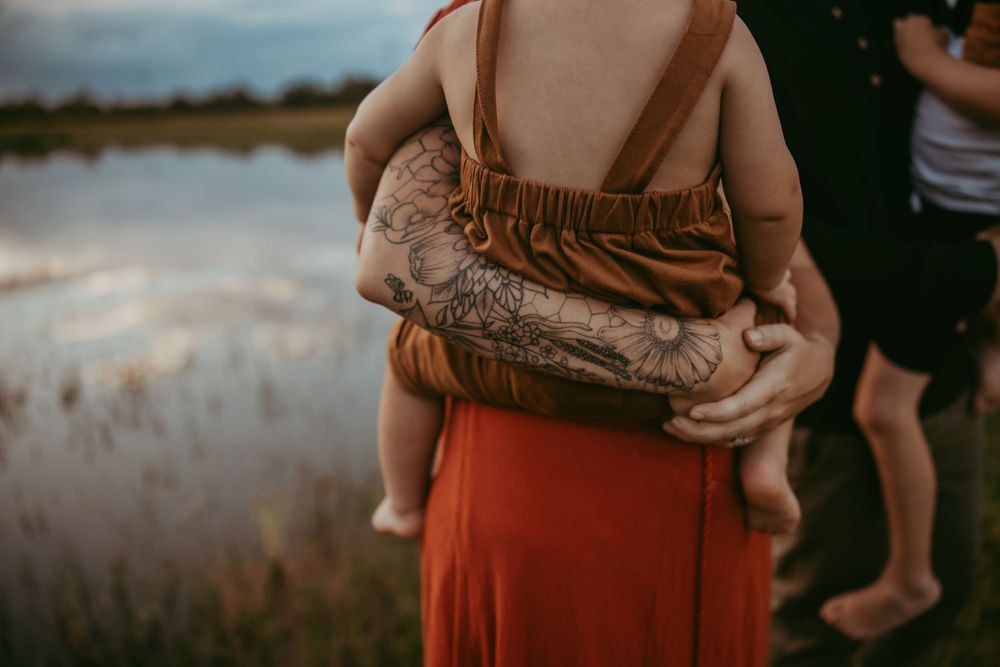 lakeland photographer- mom with tattoo arm, holding son