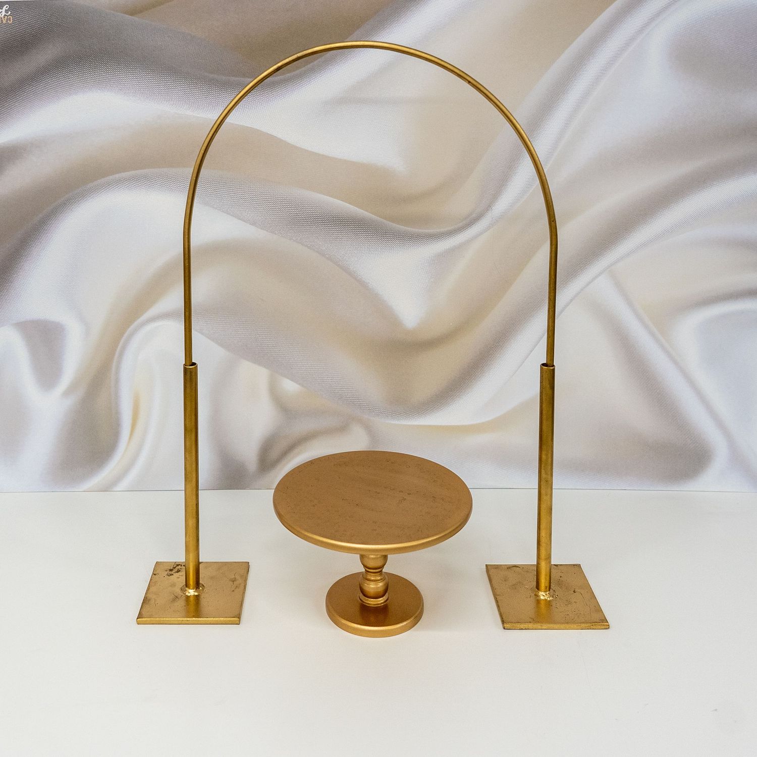 Gold Arch Hire with Gold Pedestal Stand