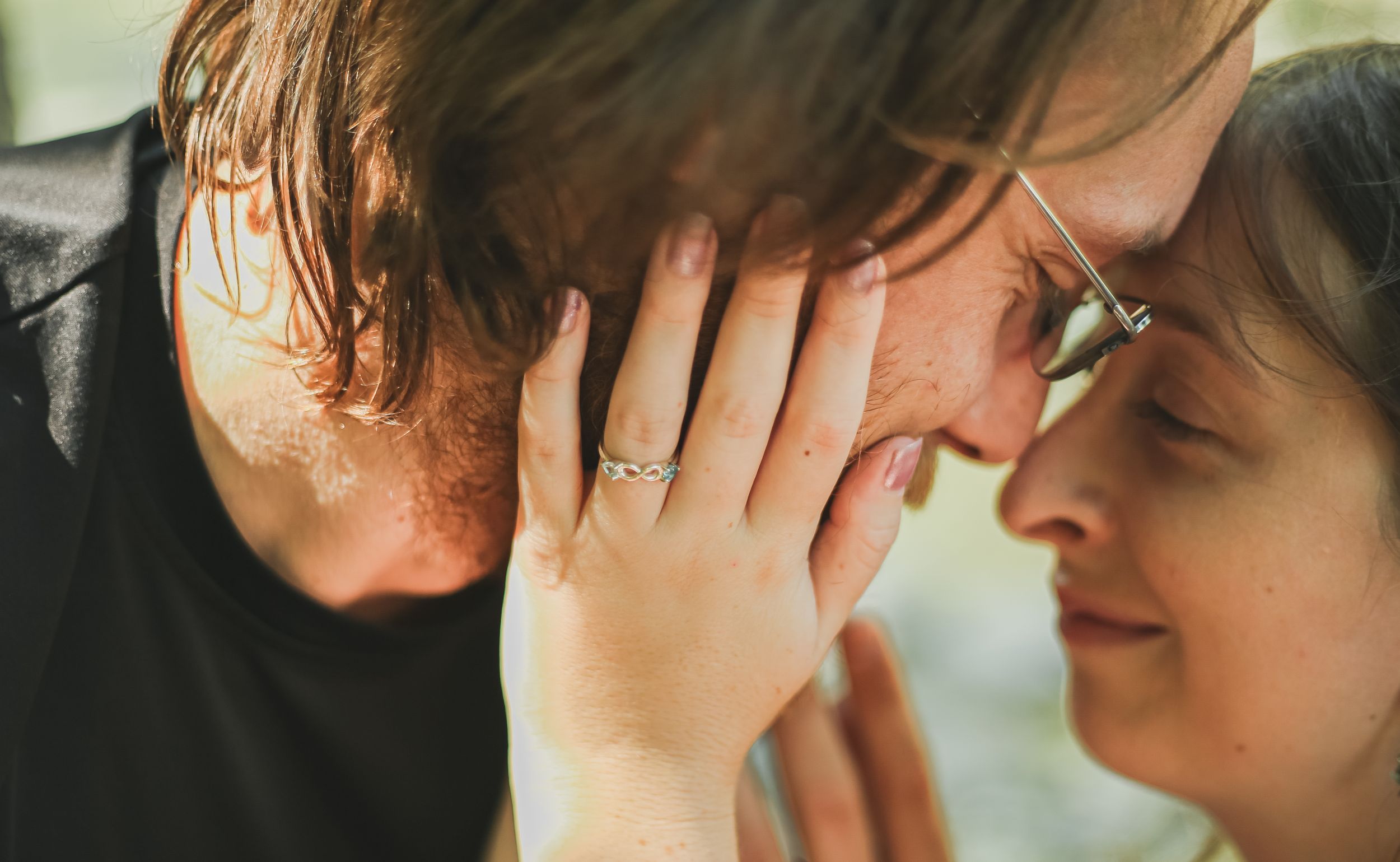 engaged couple portrait at ithaca falls, ny showing engagement ring
