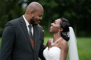 Destination Wedding Photographer capturing couple in field